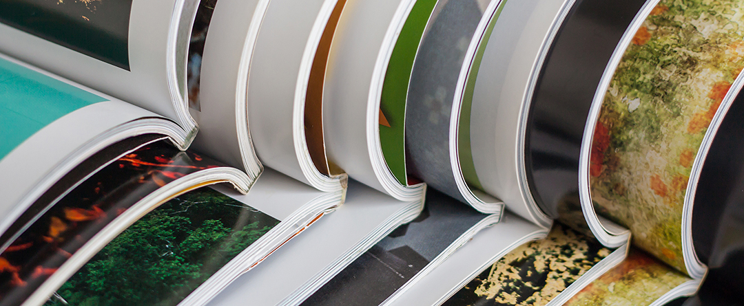 catalogues stacked on top of each other