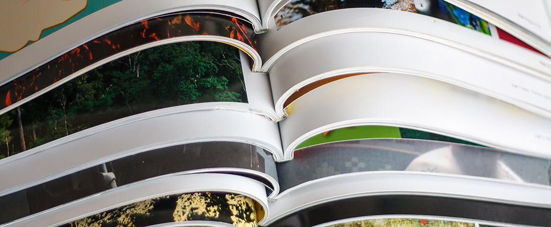 magazine-01 pile of printed magazines in a binder