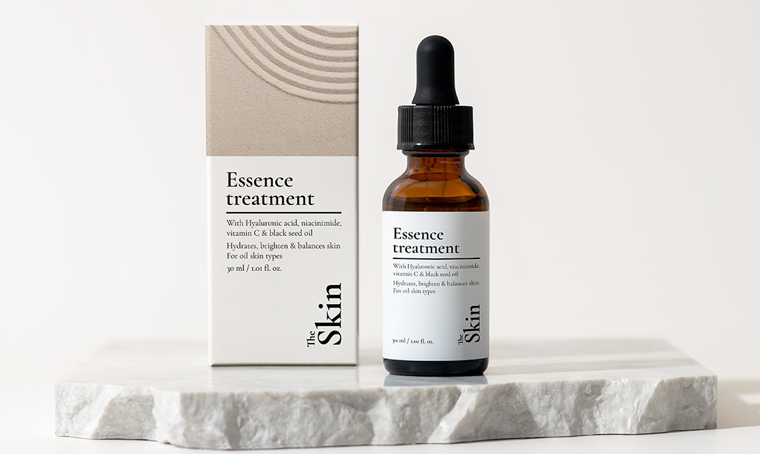 a girl laying in grass with a book