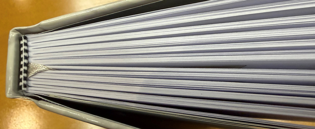 Many coiled school books together; repeating pattern of coils ho