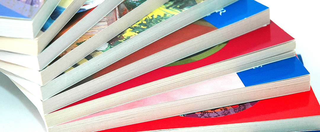 Many coiled school books together; repeating pattern of coils ho