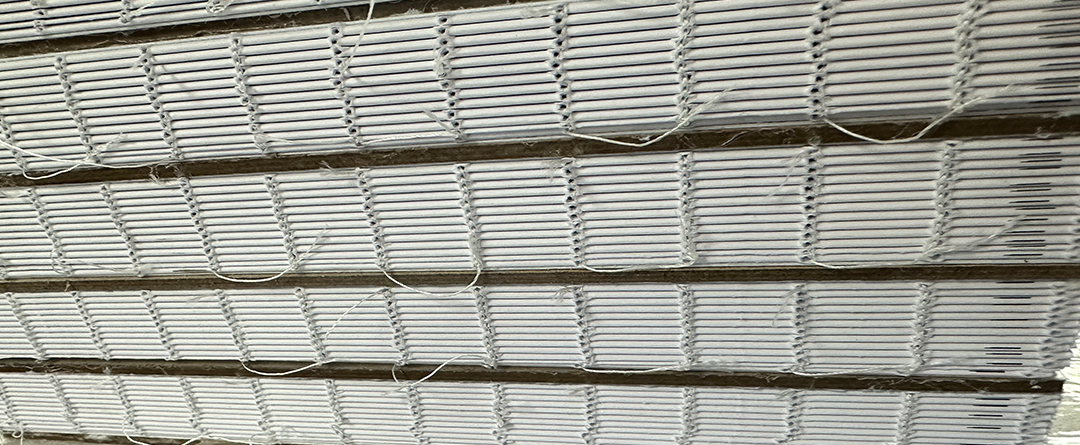 Many coiled school books together; repeating pattern of coils ho