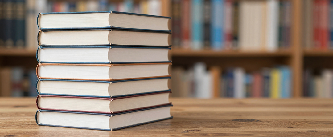 Many coiled school books together; repeating pattern of coils ho