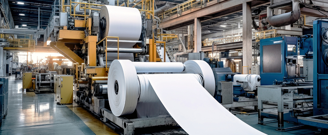 red push pin marked on 29th of white calendar on wooden desk wi