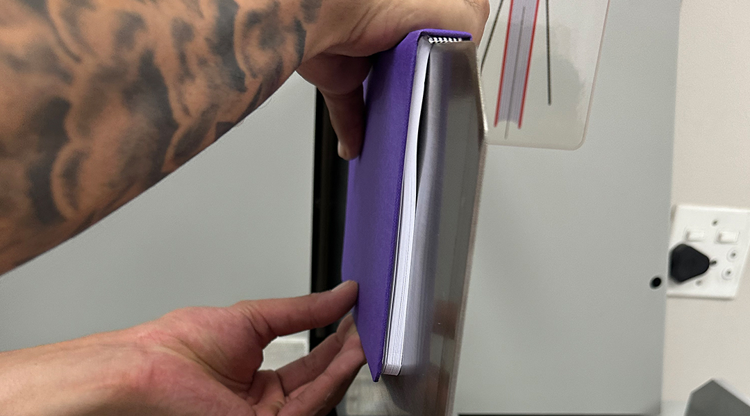 Many coiled school books together; repeating pattern of coils ho